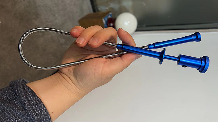 I used the Flexible Magnetic Pickup Tool with Claws and LED light to pick up toothbrush from drain
